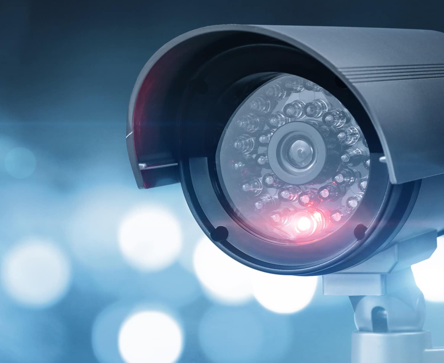 Close up of CCTV camera over defocused background with copy space